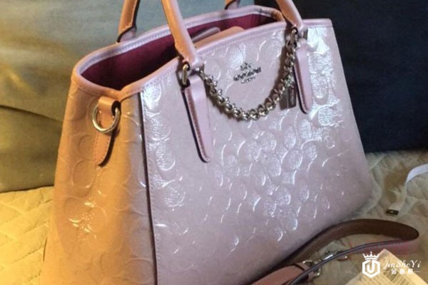 蔻驰珠光浮雕牛皮手提包